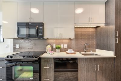 Kitchen with Oven, Stove, Microwave, Wood Cabinents and Sink